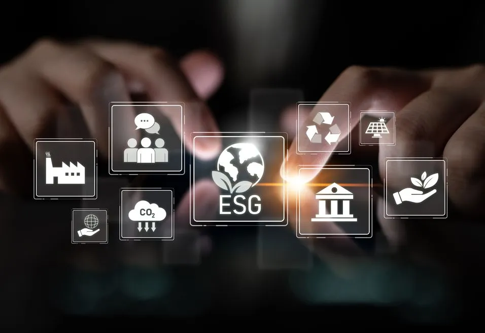 Hands interacting with floating ESG icons, including a factory, people, CO2, recycling, solar panel, bank, and leaf, on a dark background.